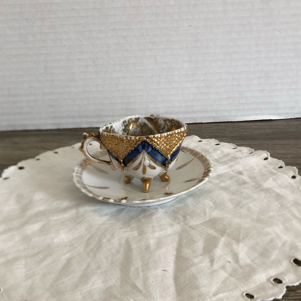Antique Porcelain Demitasse Cup with Ornate Design